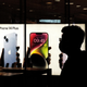Customers line up at an Apple Store to pick up their orders of the new iPhone 14 on September 16, 2022 in Wuhan, Hubei, China